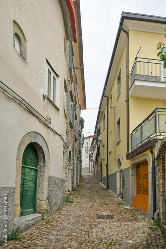 A small street between the old houses of Agnone  a medieval village in the mountains of the Molise region  Italy.