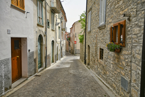 A small street between the old houses of Agnone, a medieval village in the mountains of Molise region in Italy.