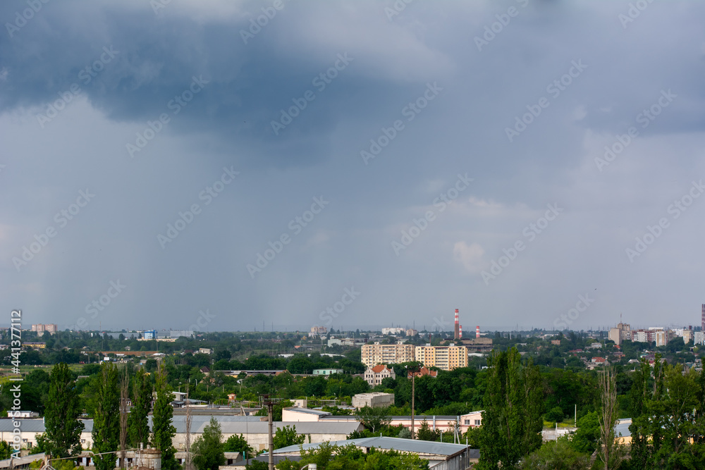 HDR city landscape. Gloomy rainy sky over the city