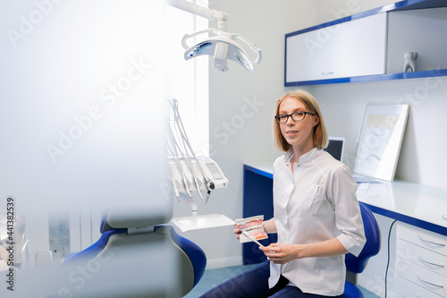 Dentist in a light office. Dental equipment