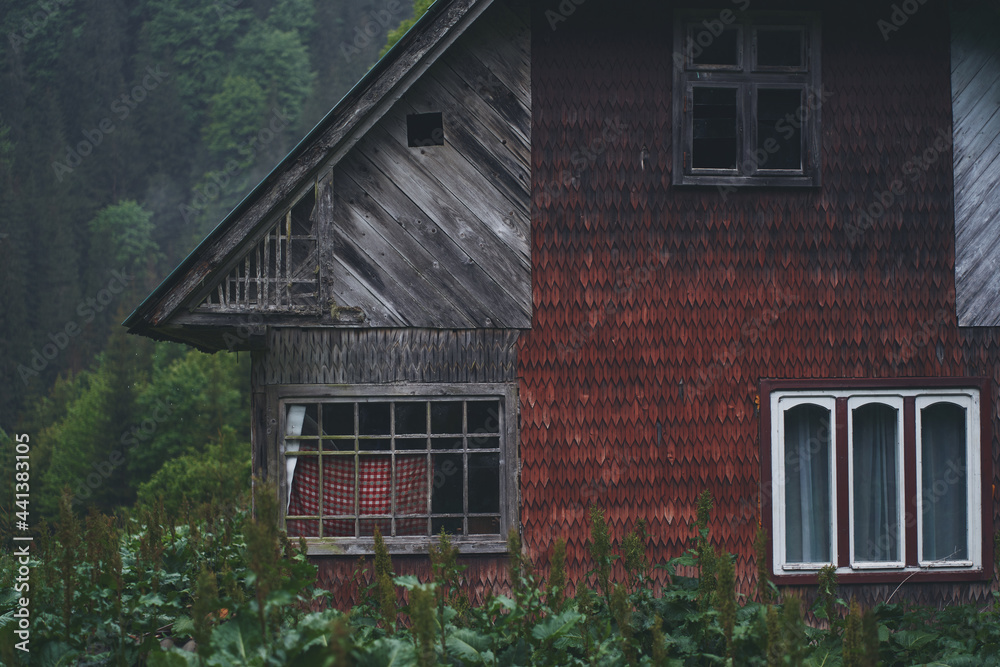 Old abandoned wooden house in the mountains. Ukrainian Carpathian mountains.