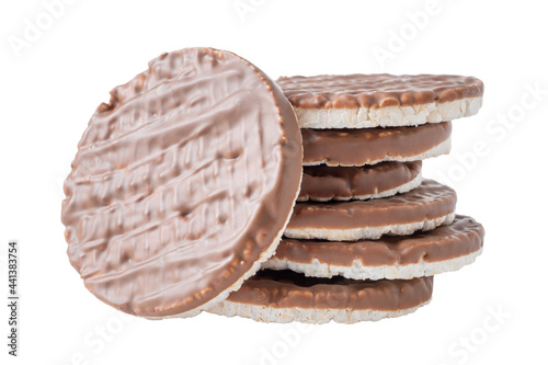 Stack of rice crispbreads with chocolate isolated on white. Healthy puffed crunchy round rice cakes for dietary.