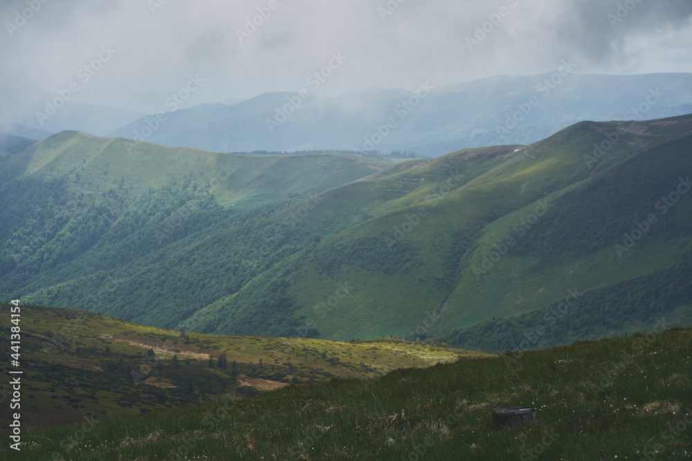 Low clouds and fog over the mountains. Svidovets ridge. Ukraine, Carpathian mountains.