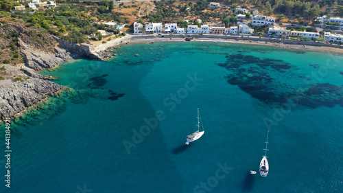 Aerial drone photo of beautiful twin bay, beach and small village of Kapsali below iconic castle of Kythera island, Ionian, Greece