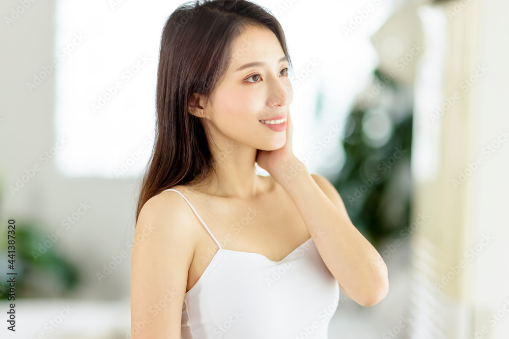 Smiling beautiful asian beauty with clean healthy skin Smiling beautiful asian beauty with clean healthy skin