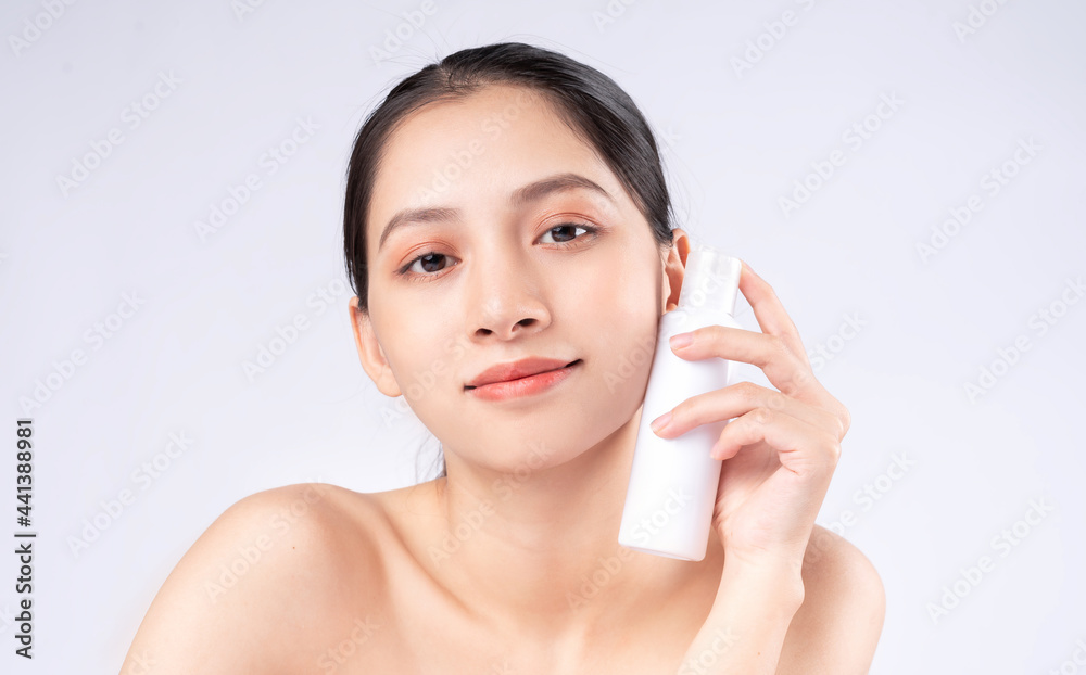 Attractive young Asian woman with youthful skin. Facial care, facial treatment, woman beauty skin isolated on white background. cosmetology, skin beauty and cosmetic concept Attractive young Asian woman with youthful skin. Facial care, facial treatment, woman beauty skin isolated on white background. cosmetology, skin beauty and cosmetic concept
