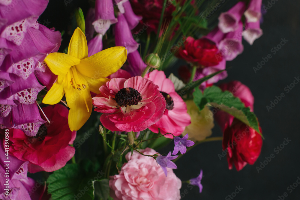 Beautiful summer flowers on a dark background.