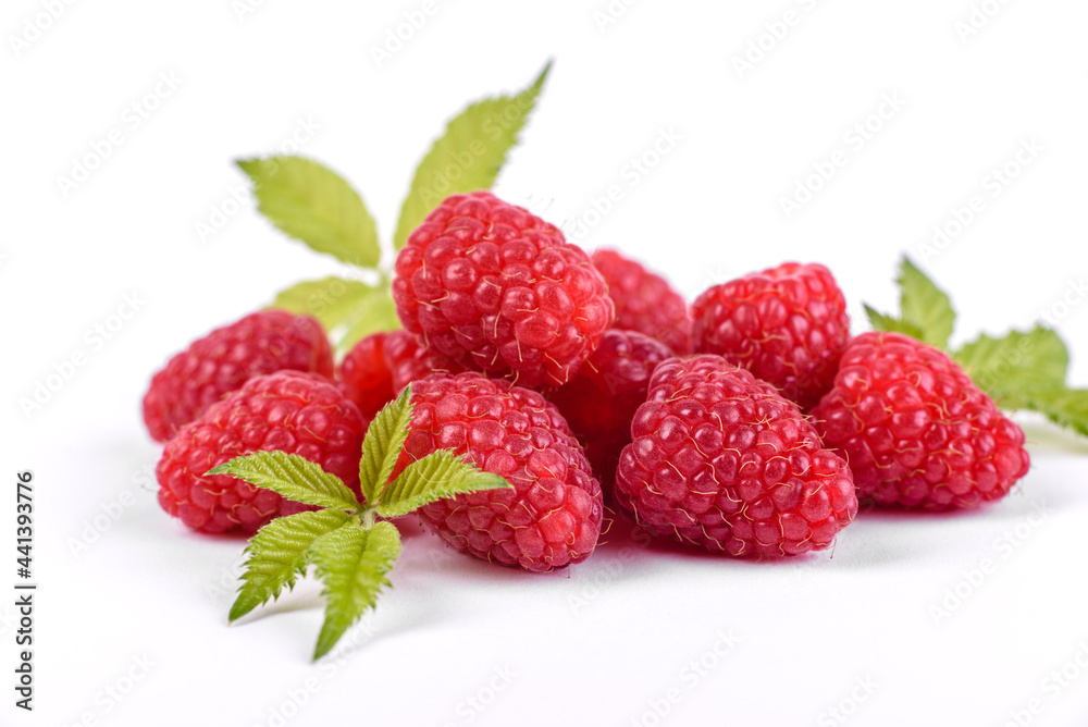 Ripe raspberries with raspberry leaf isolated on a white background