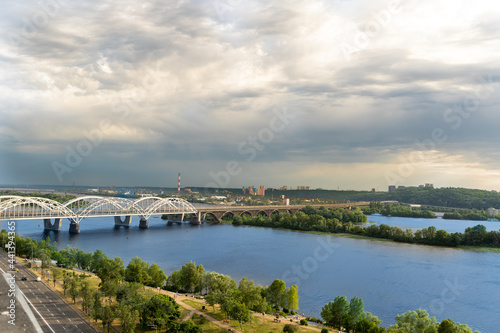 Panoramic view of the right bank of Kyiv. Dnieper river, evening and sunset. Metro bridge. Sight. Nice view from the balcony.