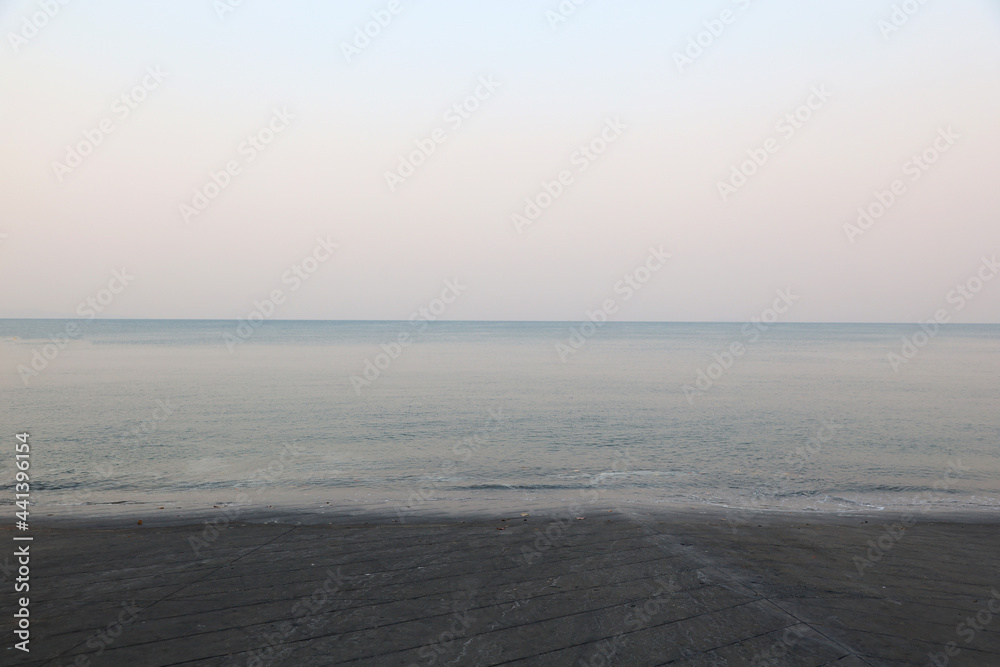 Soft wave sea and blue sky background in the morning at Thailand.