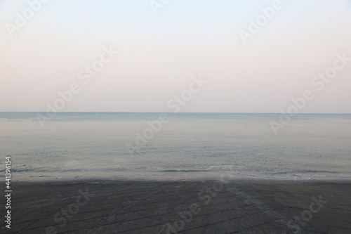 Soft wave sea and blue sky background in the morning at Thailand.