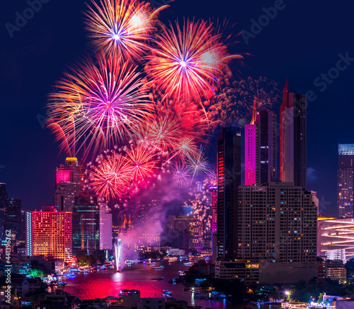 night light city of bangkok cityscape with firework celebrate in Twilight night background bangkok city, Thailand.