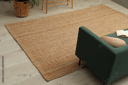 Beige carpet on wooden floor in living room