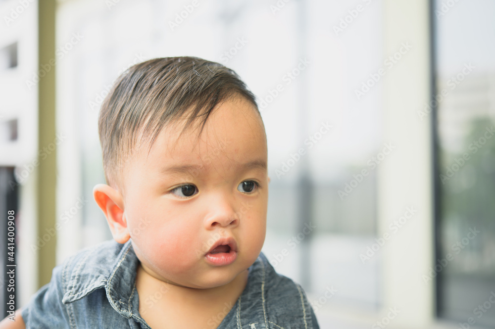 Portrait of cute toddler boy with Blue jean shirt