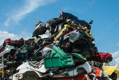 Pile of crushed junk cars on scrapyard