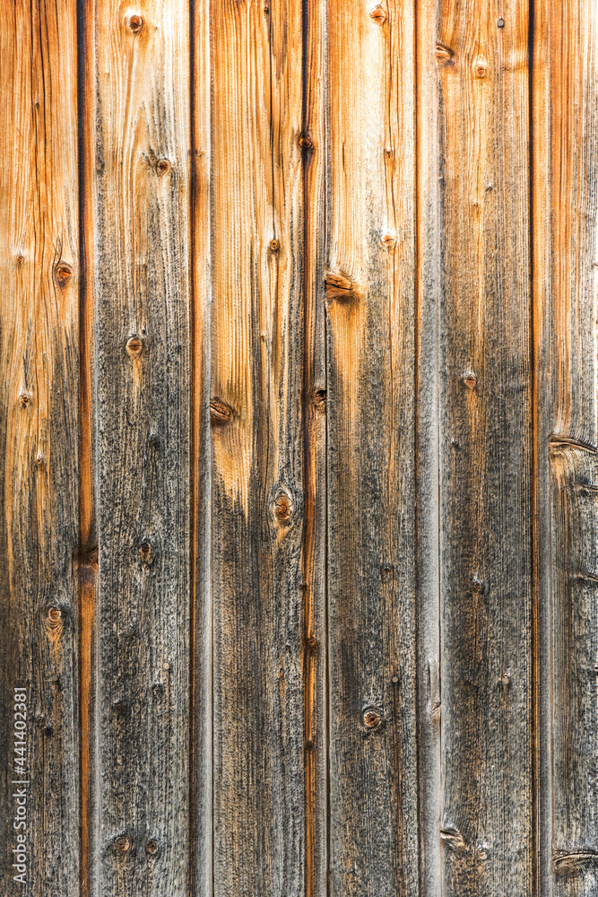 Closeup shot of brown, weathered wooden wall (background vertical)