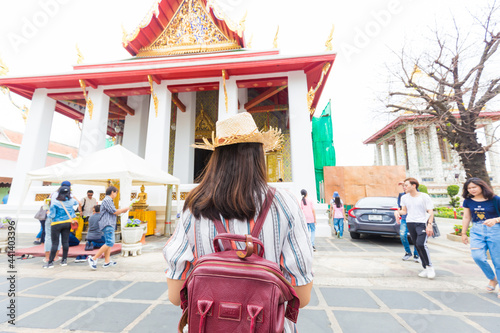 Asian backpacker women wear sun hat traverl in temple of buddha © themorningglory
