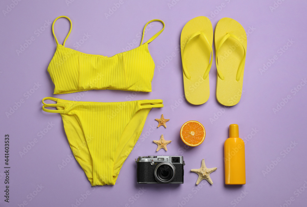 Flat lay composition with beach objects on violet background Flat lay composition with beach objects on violet background