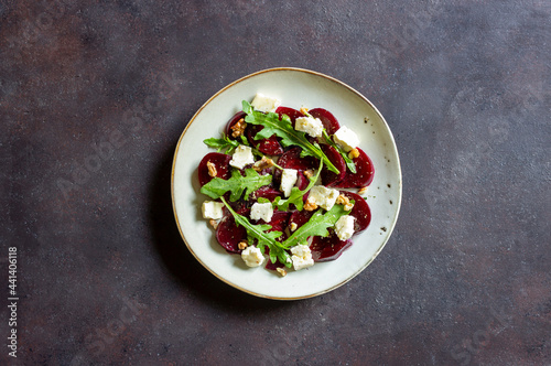 Beetroot salad with cheese, arugula, nuts and honey. Healthy eating. Vegetarian food.