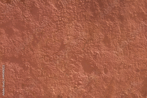 Background with wall texture with red paint.