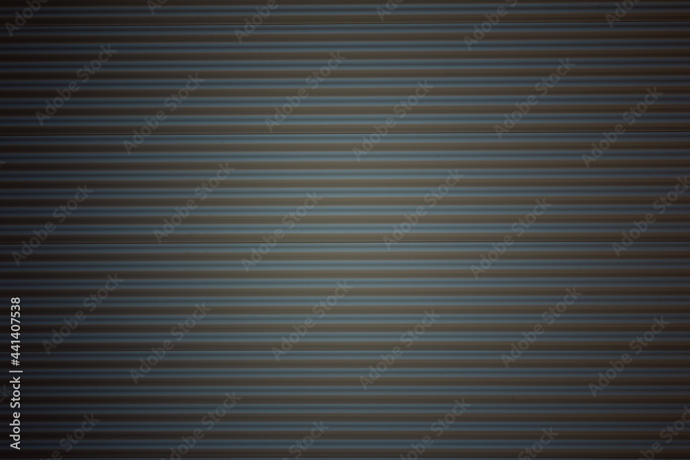 Obraz premium Abstract silver background with horizontal lines, lit with a soft light