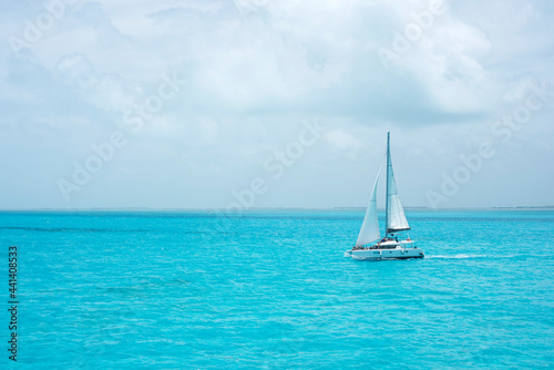A luxury catamaran with some tourists sailing in the ocean of the Mexican Caribbean