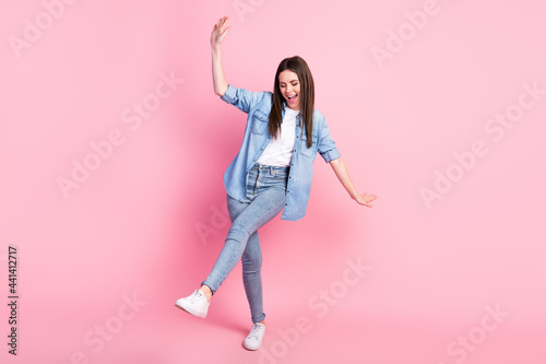 Full size photo of cheerful positive nice young woman dance good mood smile isolated on pink color background