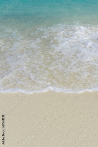beautiful sea waves and sand for space text or background summer concept