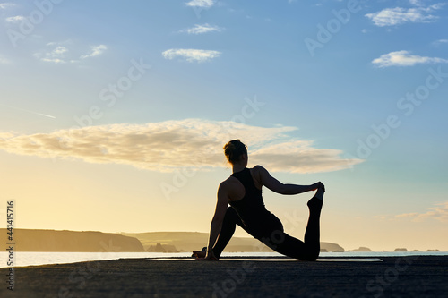 healthy lifestyle practicing yoga and pilates outdoors