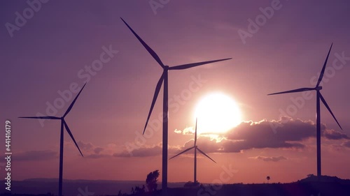 Windturbine for clean energy at sunset 