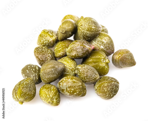 Pile of pickled capers isolated on white background with clipping path  macro