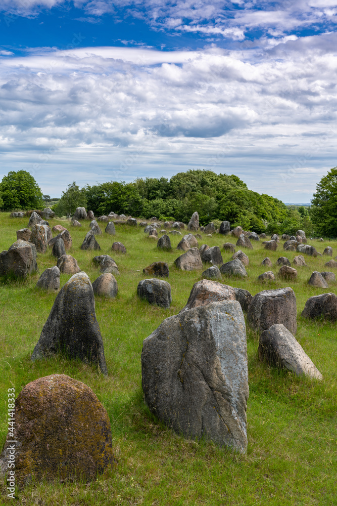 Φωτογραφία vertical view of the Viking burial grounds at Lindholm Hills under a blue sk wit