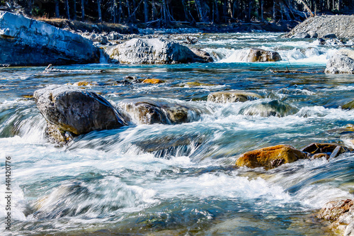 Fast flowing water rushes over the falls. Elbow Falls Provincial Recreation Area, Alberta, Canada