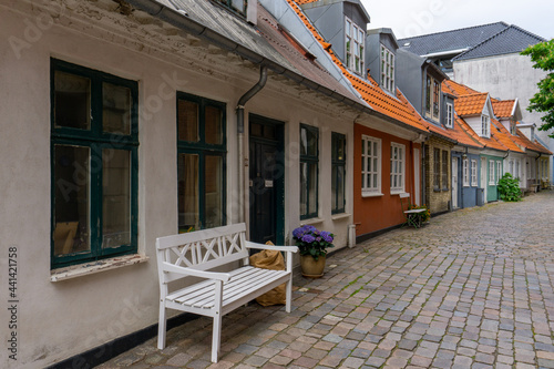 a cobblestone street and colorful small houses in the historic old city center of Aalborg photo