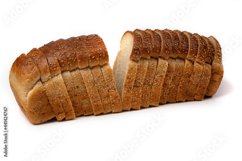 Slices of white bread or a loaf with sesame seeds isolated on a white background.