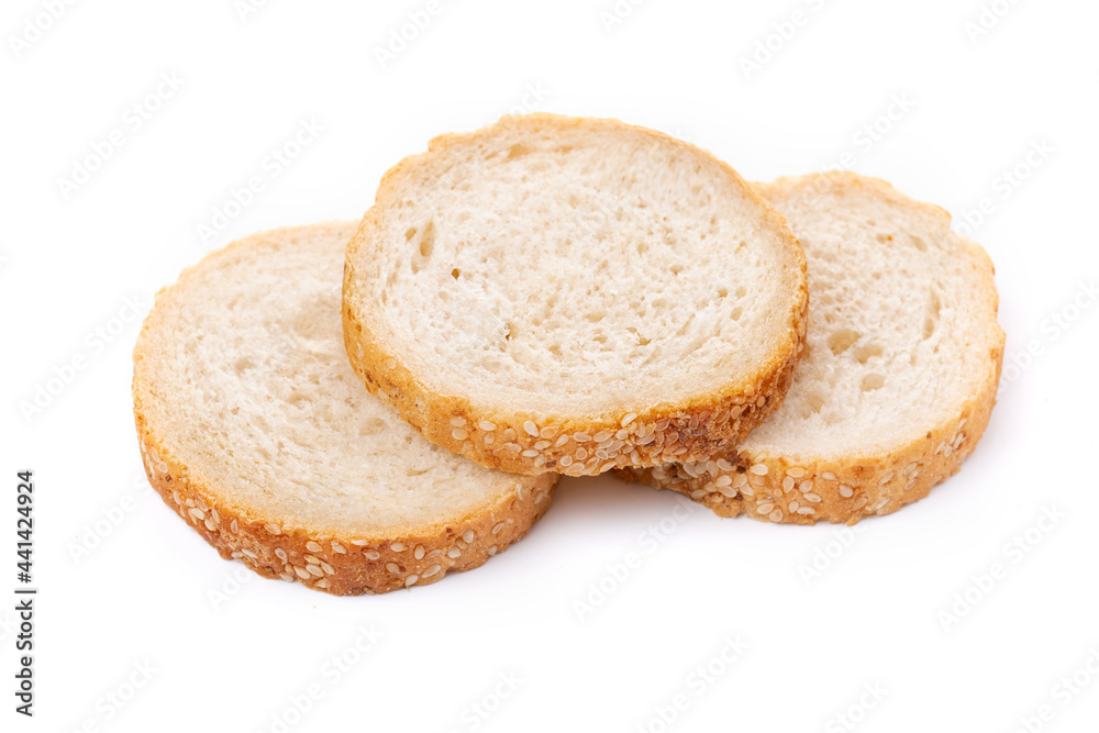 Slices of white bread or a loaf with sesame seeds isolated on a white background.