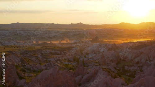 4k stock video footage of amazing sunny aerial view on scenic ancient valleys of Cappadocia, Turkey photo