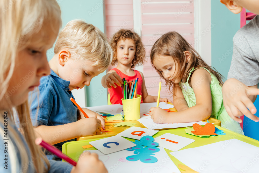 Preschool children learn english alphabet using cards Preschool children learn english alphabet using cards