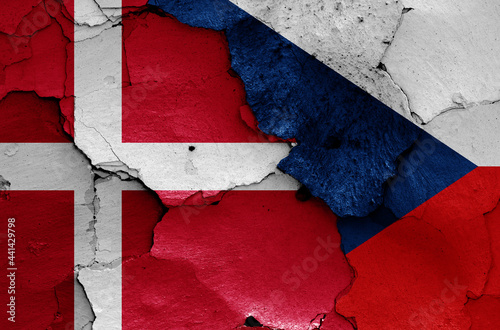 flags of Denmark and Czechia painted on cracked wall