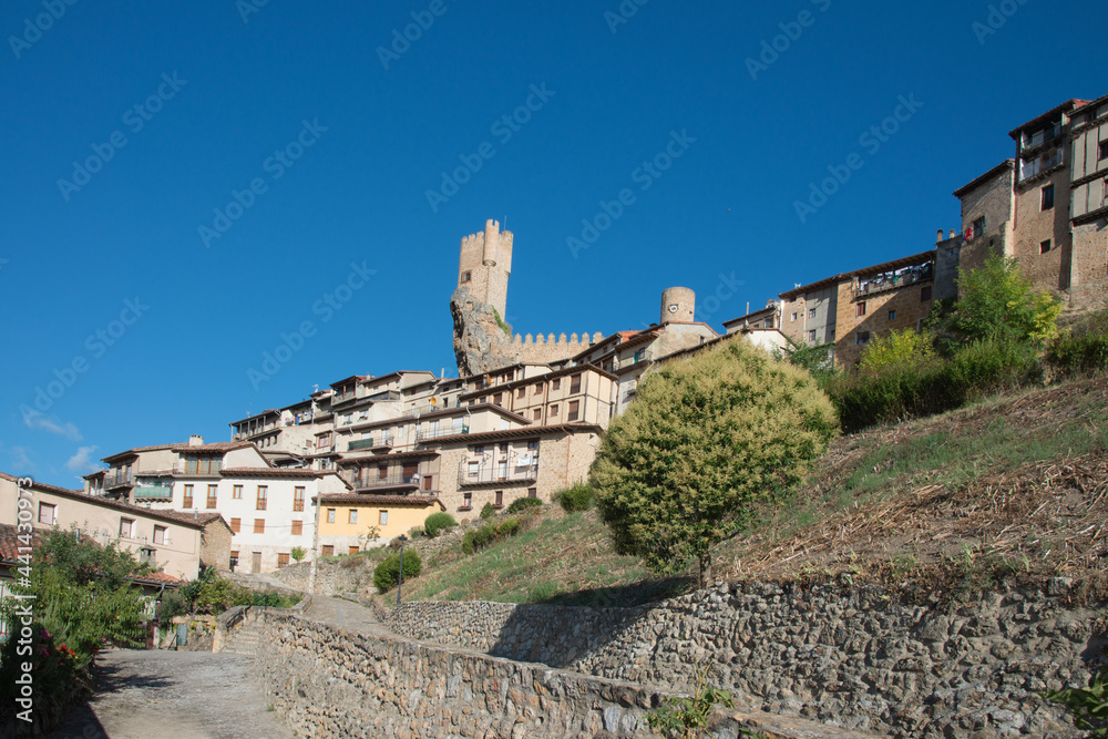 Beautiful view of Frias castle and houses. Seen from the low part of the town. Blue sky. Burgos, Merindades, Spain, Europe