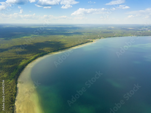 Drone view of Lake Naroch on a sunny summer day, Belarus. Beautiful landscape with a drone on the lake