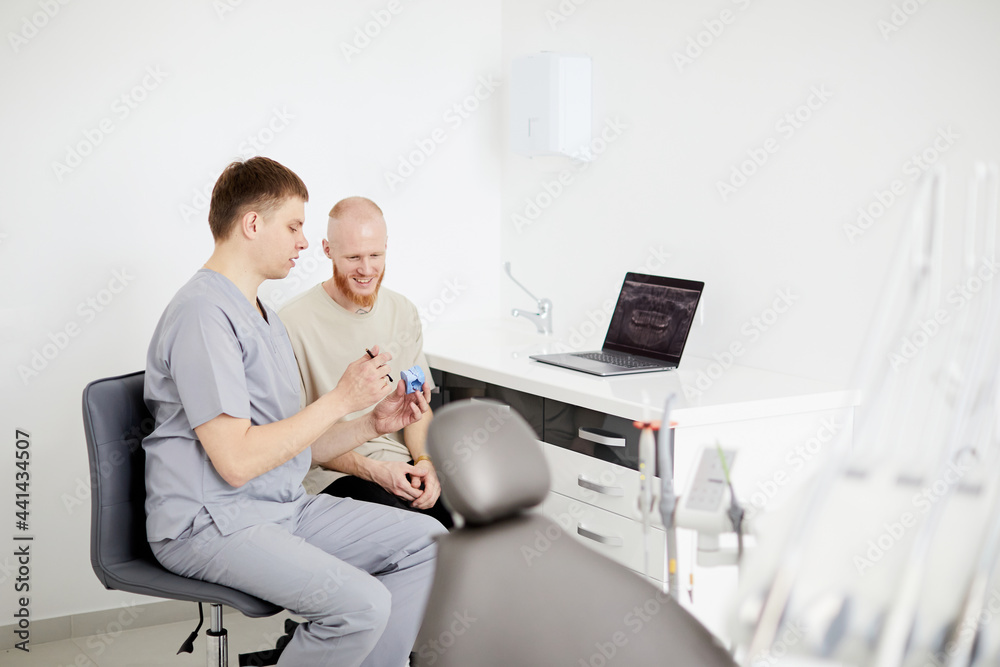 Dental care is simple. Young man on a dentist visit at the local dental clinic Dental care is simple. Young man on a dentist visit at the local dental clinic