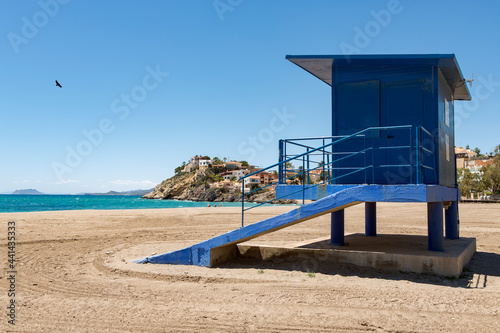 blue lifeguard station at bolnuevo beach, alicante, spain, closed and no people on the beach photo