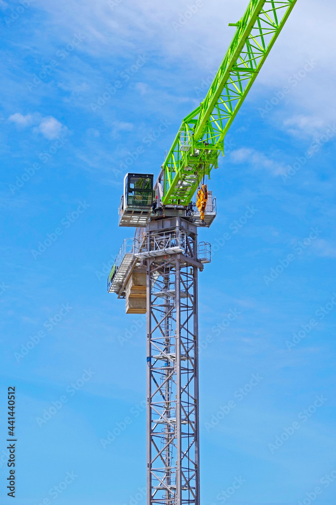 Naklejka premium construction crane at blue sky background