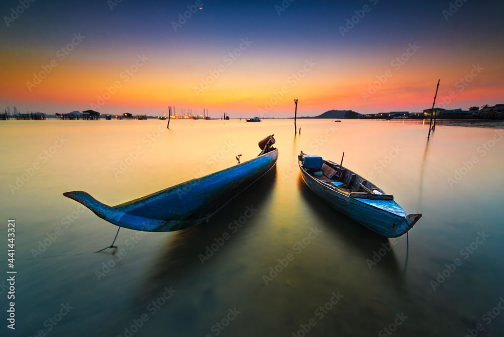 Naklejka premium Traditional boat at beauty sunset in Bataam Island