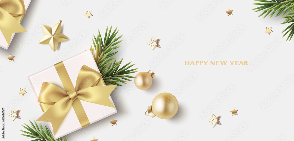 New Year and Christmas design template. Xmas background with decorative gold star, confetti, fir twig, balls and gift box isolated on gray. Vector stock illustration.