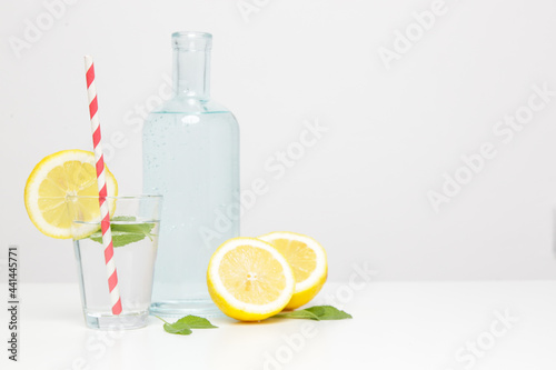 Lemon water with bamboo straw. Healthy detox drink. Reusable bamboo straws as an alternative for single-use plastic straws, healthy and sustainable lifestyle concept