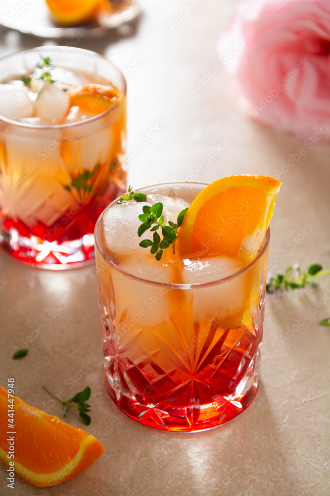 Summer drink with strawberries, oranges and fresh herb, delicious homemade lemonade with syrop Summer drink with strawberries, oranges and fresh herb, delicious homemade lemonade with syrop
