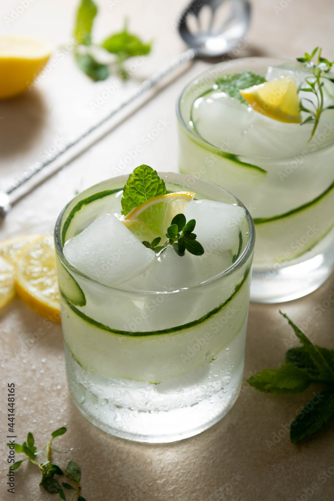 Cold drinks with cucumber, lemon and ice. Summer refreshing lemonade. Cold drinks with cucumber, lemon and ice. Summer refreshing lemonade.