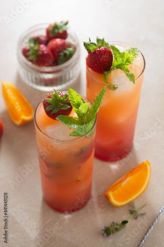 Strawberry lemonade sangria with fresh orange fruit and mint. Refreshing summer fruit cocktails.